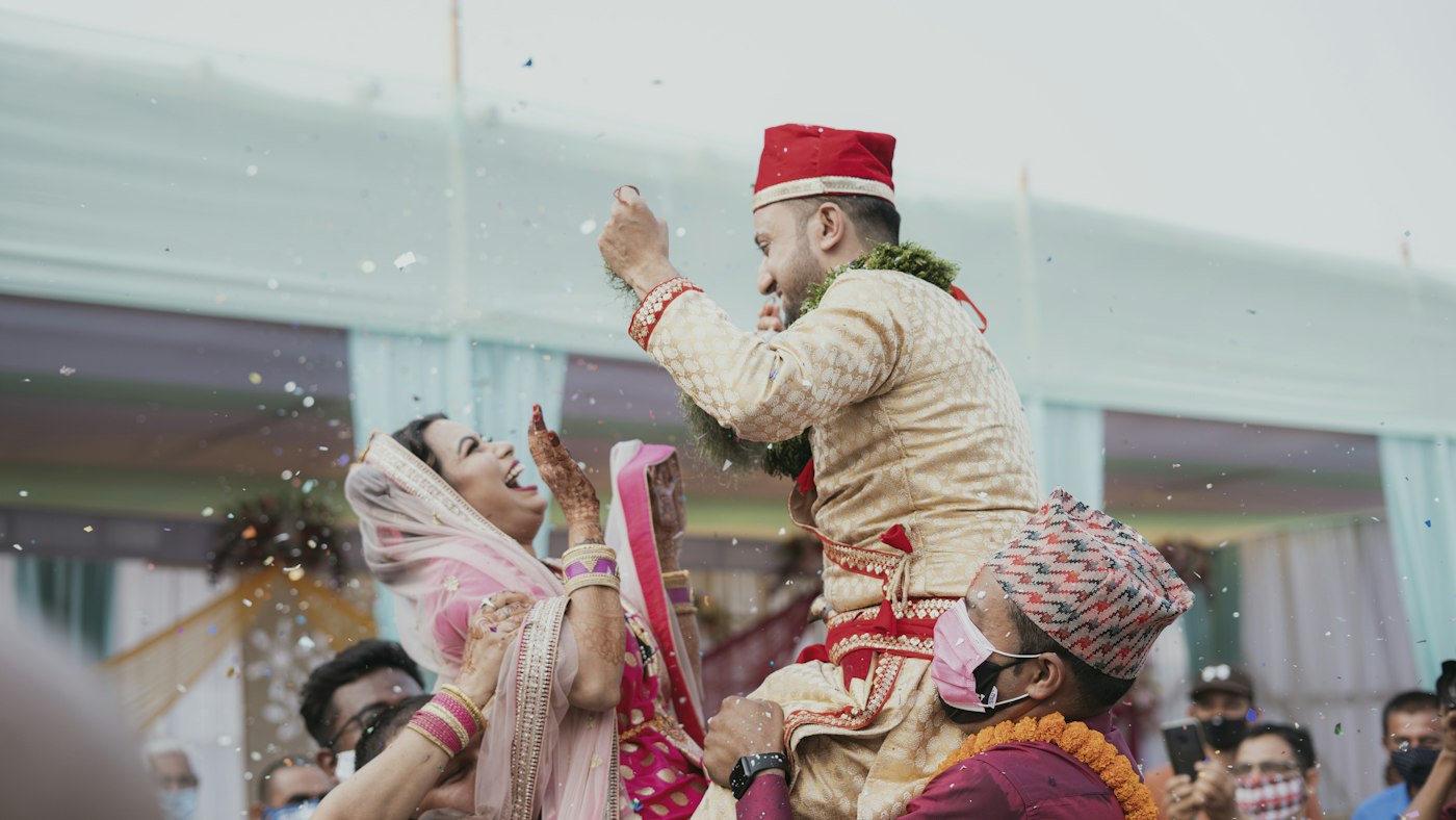 Groom dancing with guests at the baraat